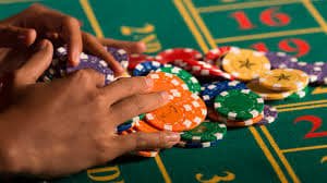 Mobile phone showing 999k app home screen with casino games designed for Bangladesh adults